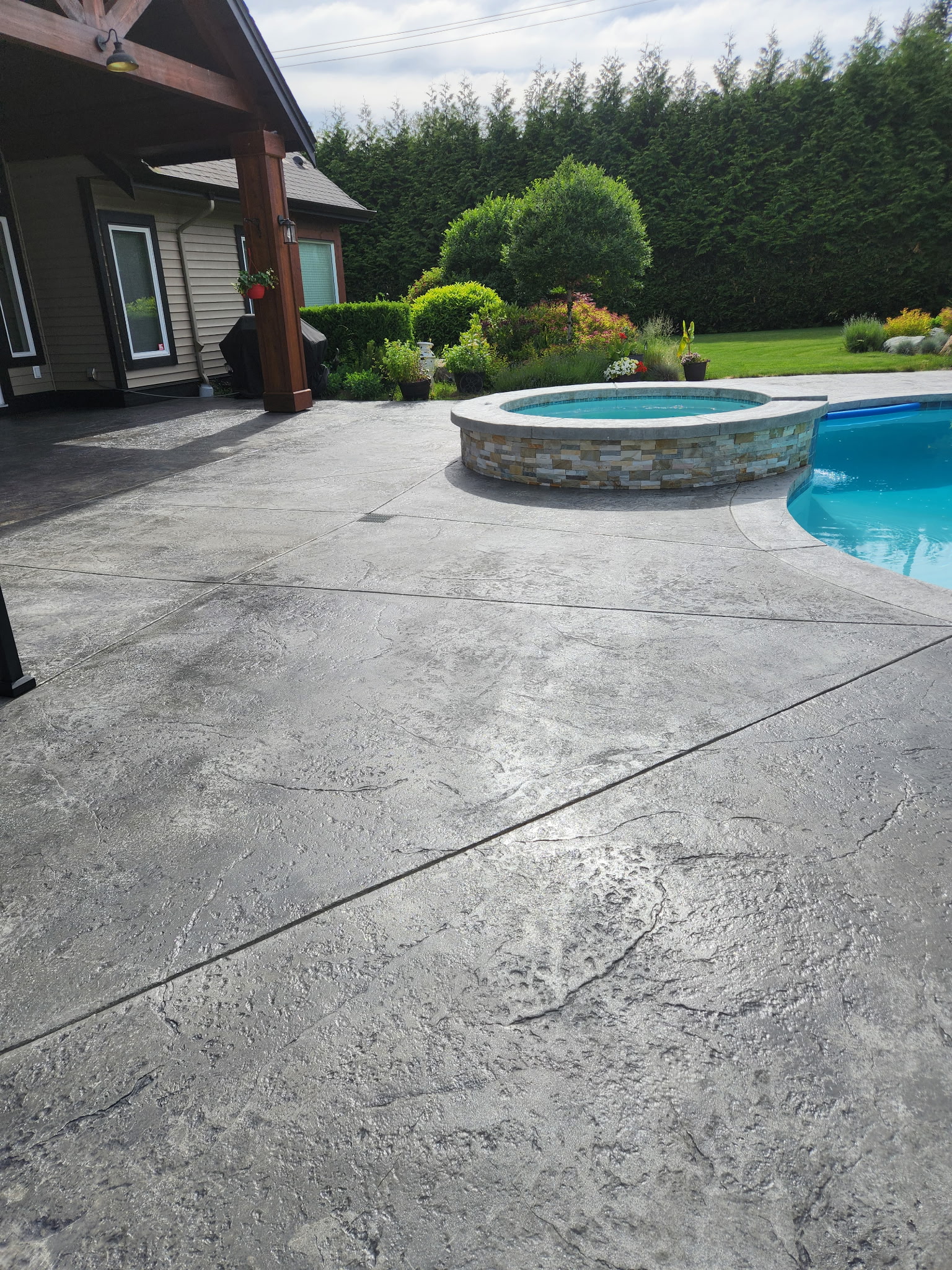Concrete sealing service protecting a driveway and patio in Surrey BC